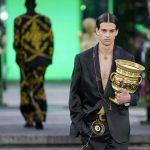 
              A model wears a creation as part of the Versace men's Spring Summer 2023 collection presented in Milan, Italy, Saturday, June 18, 2022. (AP Photo/Luca Bruno)
            