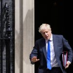 
              British Prime Minister Boris Johnson leaves 10 Downing Street in London, Wednesday, July 6, 2022. A defiant British Prime Minister Boris Johnson is battling to stay in power after his government was rocked by the resignation of two top ministers. His first challenge is getting through Wednesday, where he faces tough questions at the weekly Prime Minister's Questions session in Parliament, and a long-scheduled grilling by a committee of senior lawmakers. (AP Photo/Frank Augstein)
            