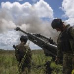 
              Ukrainian servicemen fire at Russian positions from a U.S.- supplied M777 howitzer in Kharkiv region, Ukraine, on Thursday, July 14, 2022. (AP Photo/Evgeniy Maloletka)
            