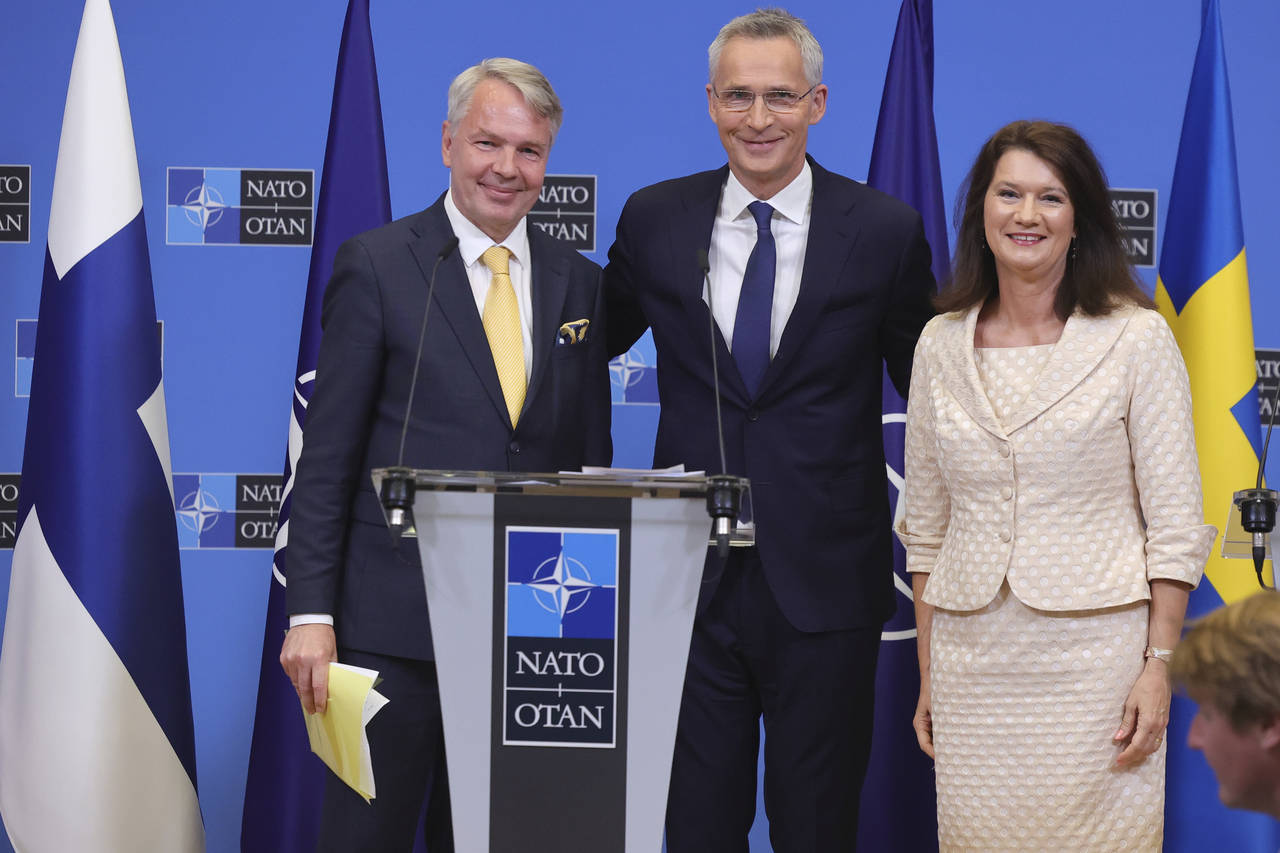 Finland's Foreign Minister Pekka Haavisto, left, Sweden's Foreign Minister Ann Linde, right, and NA...