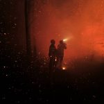 
              This photo provided by the fire brigade of the Gironde region (SDIS 33) shows firefighters working against a wildfire near Landiras, southwestern France, Saturday July 16, 2022. Firefighters are struggling to contain wildfires in France and Spain as Europe wilts under an unusually extreme heat wave that authorities link to a rise in excess mortality. (SDIS 33 via AP)
            
