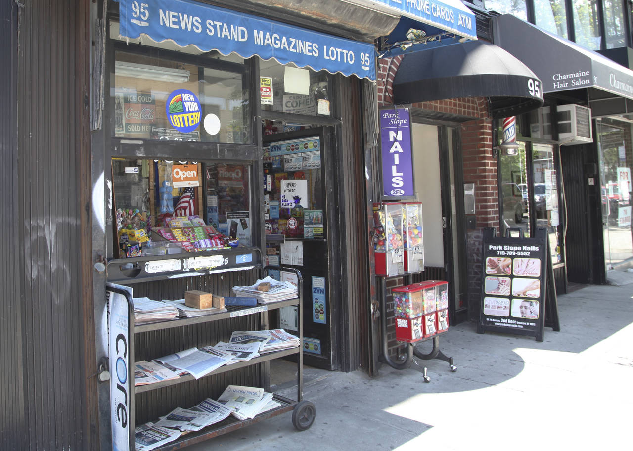 Various local newspapers appear outside a convenience store in the Brooklyn borough of New York on ...