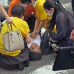 
              In this image from a video, Japan’s former Prime Minister Shinzo Abe, center, falls on the ground in Nara, western Japan Friday, July 8, 2022. Abe was shot during a campaign speech Friday in western Japan and was airlifted to a hospital but he was not breathing and his heart had stopped, officials said. (Kyodo News via AP)
            