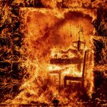 
              Flames engulf a chair inside a burning home as the Oak Fire burns in Mariposa County, Calif., on Saturday, July 23, 2022. (AP Photo/Noah Berger)
            