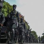
              Army soldiers patrol outside parliament building in Colombo, Sri Lanka, Saturday, July 16, 2022. Sri Lankan lawmakers met Saturday to begin choosing a new leader to serve the rest of the term abandoned by the president who fled abroad and resigned after mass protests over the country's economic collapse. (AP Photo/Rafiq Maqbool)
            