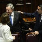 
              Italian Premier Mario Draghi, left, is greeted by Foreign Minister Luigi Di Maio, right, as he leaves at the end of his address at the Parliament in Rome, Thursday, July 21, 2022. Premier Mario Draghi's national unity government headed for collapse Thursday after key coalition allies boycotted a confidence vote, signaling the likelihood of early elections and a renewed period of uncertainty for Italy and Europe at a critical time. (AP Photo/Andrew Medichini)
            