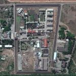 
              In this satellite photo provided by Maxar Technologies, a view of the Olenivka detention center, in Eastern Donetsk province, after an attack on the prison reportedly killed Ukrainian soldiers captured in May after the fall of Mariupol, a Black Sea port city where troops and the Azov Regiment of the national guard famously held out against a months-long Russian siege. Separatist authorities and Russian officials said the attack killed 53 Ukrainian POWs and wounded another 75.  (Satellite image ©2022 Maxar Technologies via AP)
            