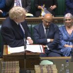 
              In this grab taken from video from the House of Commons, Britain's Prime Minister Boris Johnson speaks during Prime Minister's Questions in the House of Commons, London, Wednesday July 6, 2022. Johnson is fighting for his political future Wednesday, as two of his top Cabinet ministers walked out of their jobs and a string of more junior ministers resigned after months of political chaos.  (House of Commons/PA via AP)
            