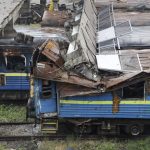 
              A collapsed bridge lies on burned-out wagons standing on the tracks at the station in Mariupol, in an area controlled by Russian-backed separatist forces, eastern Ukraine, Monday, July 11, 2022. (AP Photo)
            