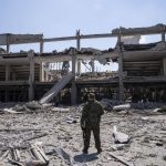 
              Ukrainian serviceman looks on National Pedagogic university destroyed by a Russian attack in Kharkiv, Ukraine, Wednesday, July 6, 2022. (AP Photo/Evgeniy Maloletka)
            