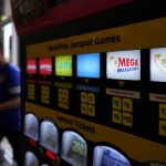 
              A lottery ticket vending machine sits a convenience store Thursday, July 21, 2022, in Northbrook, Ill. Lottery officials have raised the Mega Millions grand prize to $660 million Thursday, July 21, 2022, giving players a shot at the nation's ninth largest jackpot. (AP Photo/Nam Y. Huh)
            
