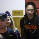 
              WNBA star and two-time Olympic gold medalist Brittney Griner is escorted to a courtroom for a hearing, in Khimki just outside Moscow, Russia, Wednesday, July 27, 2022. American basketball star Brittney Griner returned Wednesday to a Russian courtroom for her drawn-out trial on drug charges that could bring her 10 years in prison of convicted. (Evgenia Novozhenina/Pool Photo via AP)
            