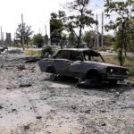 
              In this photo provided by the Luhansk region military administration, burned car and damaged residential buildings are seen in Lysychansk, Luhansk region, Ukraine, early Sunday, July 3, 2022. Russian forces pounded the city of Lysychansk and its surroundings in an all-out attempt to seize the last stronghold of resistance in eastern Ukraine's Luhansk province, the governor said Saturday. A presidential adviser said its fate would be decided within the next two days. (Luhansk region military administration via AP)
            