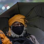 
              A Hindu pilgrim returns back after a cloudburst at Baltal, 105 kilometers (65miles) northeast of Srinagar, Indian controlled Kashmir, Saturday, July 9, 2022. More than ten pilgrims have been killed and many feared missing after a cloudburst triggered a flash flooding during an annual Hindu pilgrimage to an icy Himalayan cave in Indian-controlled Kashmir. Officials say the cloudburst near the hollowed mountain cave revered by Hindus on Friday sent a wall of water down a mountain gorge and swept about two dozen encampments and two makeshift kitchens. (AP Photo/Mukhtar Khan)
            