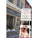 FILE - An abortion protester stands outside the Red River Valley Women's Clinic in Fargo, N.D., on Feb. 20, 2013. North Dakota's only abortion clinic is preparing for what could be its final day of performing procedures, with a trigger ban due to take effect Thursday, July 28, 2022, that will likely force patients to travel hundreds of miles to receive care pending the clinic's relocation across the border to Minnesota. (AP Photo/Dave Kolpack, File)