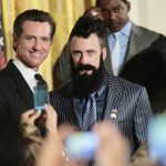 
              FILE - Then-California Lt. Gov Gavin Newsom, left, poses with San Francisco Giants baseball pitcher pitcher Brian Wilson at the White House during a ceremony in Washington on July 25, 2011. California Democratic Gov. Gavin Newsom is headed to Washington this week. The East coast swing is anchored to an award Newsom will receive Wednesday, July 13, 2022, from an education group recognizing, among other things, that California is on track to establish universal pre-K classes for all 4-year-olds by 2025. (AP Photo/Pablo Martinez Monsivais, File)
            