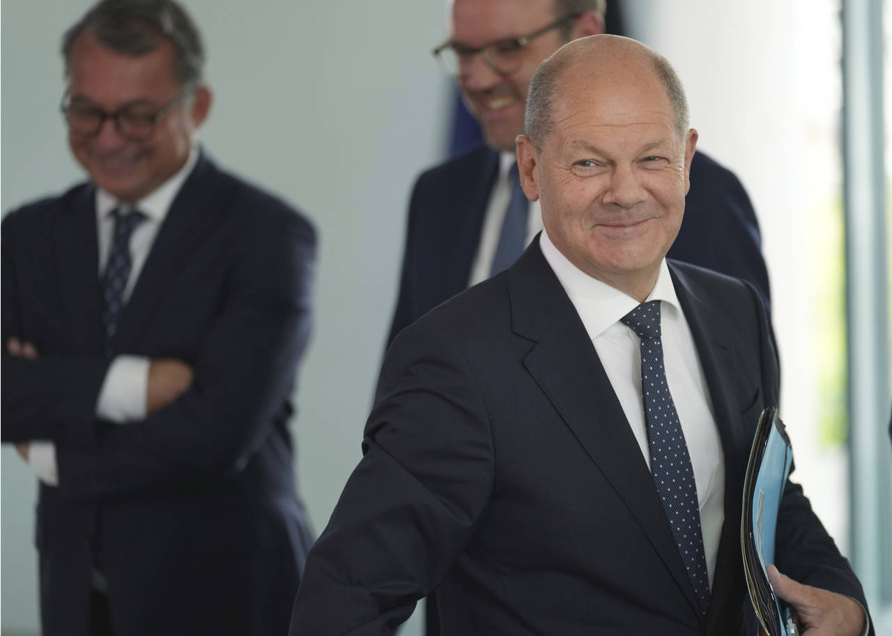 German Chancellor Olaf Scholz, front, arrives for the 'Concerted Action', a meeting of representati...