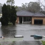 
              A house sits semi-submerged in flood waters near Richmond on the outskirts of Sydney, Australia, Monday, July 4, 2022. More than 30,000 residents of Sydney and its surrounds have been told to evacuate or prepare to abandon their homes on Monday as Australia's largest city braces for what could be its worst flooding in 18 months. (AP Photo/Mark Baker)
            