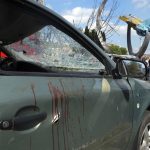 
              Blood stains are seen on a damaged car after a deadly Russian missile attack in Vinnytsia, Ukraine, Thursday, July 14, 2022. (AP Photo/Efrem Lukatsky)
            