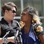 
              George Floyd's partner Courteney Ross, left,  talks to the media outside the Federal Courthouse with Toshira Garraway Allen, an organizer for Families Supporting Families Against Police Violence Wednesday, July 27, 2022 in St. Paul, Minn. The last two former Minneapolis police officers who were convicted of violating George Floyd’s civil rights have been sentenced in federal court. J. Alexander Kueng was sentenced Wednesday to three years and Tou Thao got a 3 1/2-year sentence. They were convicted in February of two counts of violating Floyd’s civil rights.  (David Joles/Star Tribune via AP)
            