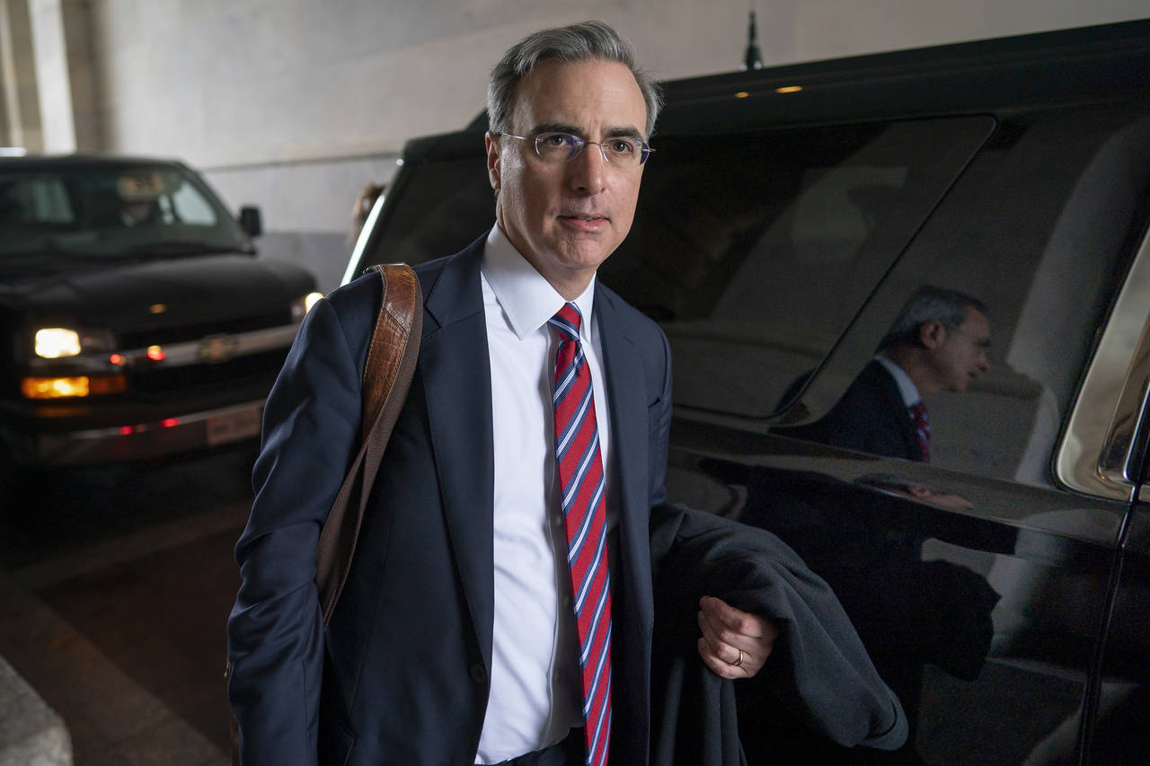 FILE - White House counsel Pat Cipollone departs the U.S. Capitol following defense arguments in th...