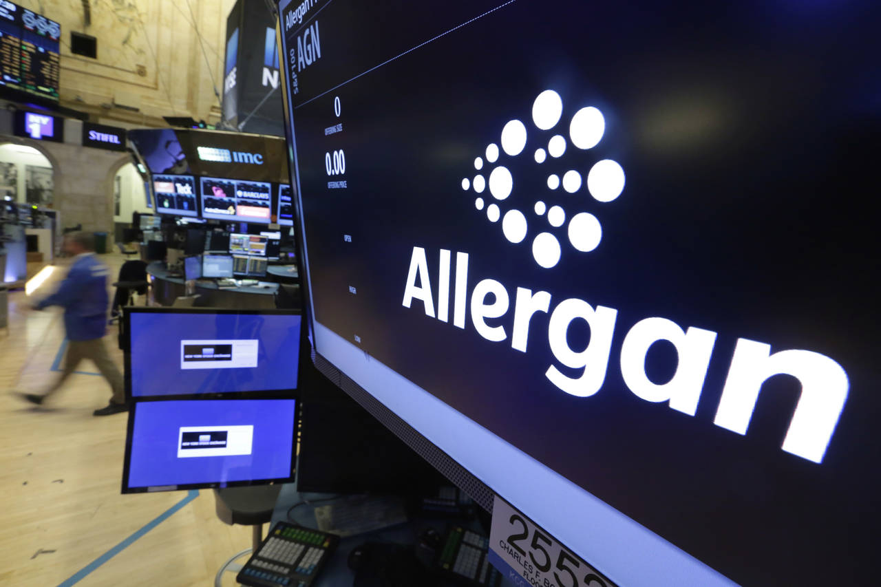 FILE - The Allergan logo appears above a trading post on the floor of the New York Stock Exchange o...