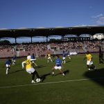 
              Players challenge during the women's final game of the national cup of working-class neighborhoods betwwen a team representing players with Malian heritage in yellow against one with Congolese roots, in Creteil, outside Paris, France, Saturday, July 2, 2022. This amateur tournament aims to celebrate the diversity of youth from low-income communities with high immigrant populations, areas long stigmatized by some observers and politicians as a breeding ground for crime, riots, and Islamic extremism. (AP Photo/ Christophe Ena)
            