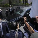 
              The vehicle which is believed to carry the body of former Prime Minister Shinzo Abe arrives at his home in Tokyo, Saturday, July 9, 2022. Abe was shot Friday while delivering his speech to support the Liberal Democratic Party's candidate during an election campaign in Nara, western Japan. (AP Photo/Hiro Komae)
            