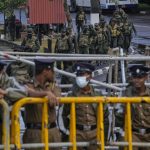 
              Army soldiers patrol outside the parliament complex in Colombo, Sri Lanka, Saturday, July 16, 2022. Sri Lankan lawmakers met Saturday to begin choosing a new leader to serve the rest of the term abandoned by the president who fled abroad and resigned after mass protests over the country's economic collapse. (AP Photo/Rafiq Maqbool)
            