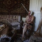 
              66-year-old Volodymyr, injured from a strike, sits on a chair in his damaged apartment, in Kramatorsk, Donetsk region, eastern Ukraine, Thursday, July 7, 2022. (AP Photo/Nariman El-Mofty)
            