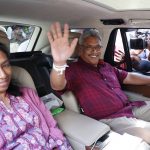 
              FILE - Then Sri Lanka's former Defense Secretary and presidential candidate Gotabaya Rajapaksa, right, waves to the media as he leaves with his wife Ayoma after casting vote in Embuldeniya, on the outskirts of Colombo, Sri Lanka, Saturday, Nov. 16, 2019. Sri Lanka's President Gotabaya Rajapaksa, his wife and two bodyguards left aboard a Sri Lankan Air Force plane bound for the city of Male, the capital of the Maldives, according to an immigration official who spoke on the condition of anonymity because of the sensitivity of the situation Wednesday, July 13, 2022.(AP Photo/Eranga Jayawardena)
            