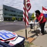 
              FILE - Defenders of the Unborn founder Mary Maschmeier, sets up a table outside Planned Parenthood on June 24, 2022, in St. Louis. Most abortions are now illegal in Missouri following a U.S. Supreme Court decision that ended a constitutional protection for abortion. Alabama, Arizona, Georgia, Kansas and Missouri all have personhood laws. (AP Photo/Jeff Roberson, File)
            