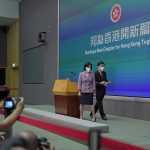 
              Hong Kong Chief Executive John Lee, right, and convener of the Executive Council Regina Ip leave a news conference in Hong Kong, Tuesday, July 5, 2022. Lee said Tuesday in his first news conference since taking the reins that he will work towards legislating easing restrictions for travelers, but that it must be balanced with limiting the spread of the coronavirus so as not to overwhelm the healthcare system. (AP Photo/Kin Cheung)
            