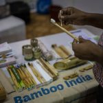 
              A visitor looks at earbuds and a toothbrush made of bamboo at an event to create awareness about eco-friendly products in New Delhi, India, Friday, July 1, 2022. India banned some single-use or disposable plastic products Friday as part of a federal plan to phase out the ubiquitous material in the nation of nearly 1.4 billion people. (AP Photo/Altaf Qadri)
            
