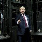 
              FILE - London Mayor Boris Johnson, gestures with a wand whilst attending a Harry Potter studio tour of Diagon Alley, at the Warner Brother Studios, London, Monday, Dec. 19, 2011. British media say Prime Minister Boris Johnson has agreed to resign on Thursday, July 7 2022, ending an unprecedented political crisis over his future. (AP Photo/Jonathan Short, File)
            