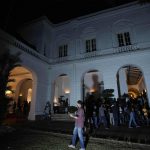 
              Protesters walk and look around after storming in at the Sri Lankan president official residence, in Colombo, Sri Lanka , Saturday, July, 9, 2022. Protesters have broken into the Sri Lankan prime minister's private residence and set it on fire, hours after he said he would resign when a new government is formed over a worsening economic crisis. It was the biggest day of demonstrations that also saw crowds storming the president's home and office. (AP Photo/ Eranga Jayawardena)
            