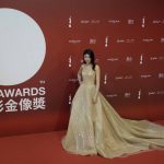 
              Hong Kong singer-actress Kelly Chen poses on the red carpet at the Hong Kong Film Awards, Sunday, July 17, 2022. (AP Photo/Kin Cheung)
            