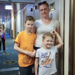
              Marina Nosylenko stands with her two sons on the ferry Isabelle in Tallinn, Estonia, Wednesday, June 15, 2022. Nosylenko left Mariupol on May 26 and took the train to St. Petersburg, Russia, with her husband and three children. They left Russia as quickly as possible, making the entire journey to Estonia in three days. (AP Photo)
            