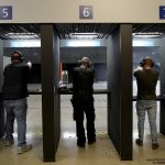 
              Gun owners fire their pistols at an indoor shooting range during a qualification course to renew their carry concealed handgun permits at the Placer Sporting Club in Roseville, Calif., on Friday, July 1, 2022. The California Department of Justice improperly revealed names and other identifying information on a website that was designed to show general data about the number and location of concealed carry gun permits. The Placer Sporting Club provides instructions and qualifies gun owners who want to carry a concealed weapon. (AP Photo/Rich Pedroncelli)
            