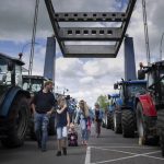 
              Protesting farmers block a draw bridge at a lock in the Princess Margriet canal, preventing all ship traffic from passing in Gaarkeuken, northern Netherlands, Monday, July 4, 2022. Dutch farmers angry at government plans to slash emissions also used tractors and trucks Monday to blockade supermarket distribution centers, the latest actions in a summer of discontent in the country's lucrative agricultural sector. (AP Photo/Peter Dejong)
            