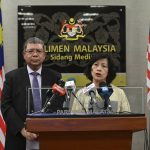 
              This handout photo taken and released by Malaysia's Department of Information shows Malaysia's Foreign Minister Saifuddin Abdullah, left, and the U.N. Secretary-General's Special Envoy on Myanmar Noeleen Heyzer attend a press conference at the Parliament House in Kuala Lumpur, Tuesday, July 26, 2022. (Malaysia's Department of Information via AP)
            