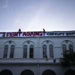 
              Protesters put up a banner on the official residence of president Gotabaya Rajapaksa three days after it was stormed by anti government protesters in Colombo in Colombo, Sri Lanka, Tuesday, July 12, 2022. A political vacuum continues in Sri Lanka with opposition leaders yet to agree on who should replace its roundly rejected leaders, whose residences are occupied by protesters angry over the country's deep economic woes. (AP Photo/Rafiq Maqbool)
            