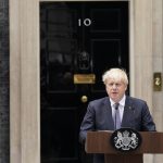 
              British Prime Minister Boris Johnson speaks to media next to 10 Downing Street in London, Thursday, July 7, 2022. Prime Minister Boris Johnson has agreed to resign, his office said Thursday, ending an unprecedented political crisis over his future that has paralyzed Britain's government. An official in Johnson's Downing Street office confirmed the prime minister would announce his resignation later. The official spoke on condition of anonymity because the announcement had not yet been made. (AP Photo/Alberto Pezzali)
            