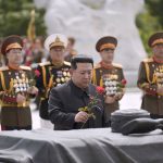 
              In this photo provided by the North Korean government, North Korean leader Kim Jong Un, center front,  offers a flower at a liberation war martyrs cemetery in Pyongyang, North Korea on the 69th anniversary of the signing of the ceasefire armistice that ends the fighting in the Korean War, Wednesday, July 27, 2022. Independent journalists were not given access to cover the event depicted in this image distributed by the North Korean government. The content of this image is as provided and cannot be independently verified. Korean language watermark on image as provided by source reads: "KCNA" which is the abbreviation for Korean Central News Agency. (Korean Central News Agency/Korea News Service via AP)
            