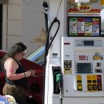 
              A woman checks her credit cards at a gas station in Palatine, Ill., Thursday, June 30, 2022.in Palatine, Ill., Thursday, June 30, 2022. U.S consumers have so far defied higher prices for gas, food, and rent and have been spending more in 2022, providing crucial support to the economy. (AP Photo/Nam Y. Huh)
            