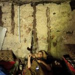 
              A Ukrainian serviceman rests in a basement between fightings with Russian forces at a frontline in Kharkiv region, Ukraine, Wednesday, July 27, 2022. (AP Photo/Evgeniy Maloletka)
            