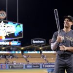 
              American League's Giancarlo Stanton, of the New York Yankees, poses with the Ted Williams Most Valuable Player trophy following the MLB All-Star baseball game against the National League, Tuesday, July 19, 2022, in Los Angeles. The American League won 3-2. (AP Photo/Mark J. Terrill)
            