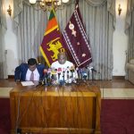
              Sri Lanka's Parliament Speaker Mahinda Yapa Abeywardana, right, speaks during a press conference in Colombo, Sri Lanka, Friday, July 15, 2022.  Abeywardana says President Gotabaya Rajapaksa has resigned and Parliament will convene to choose a new leader after massive protests took over government buildings to force him out of office. (AP Photo/Rafiq Maqbool)
            