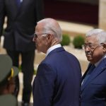 
              U.S. President Joe Biden and Palestinian President Mahmoud Abbas review the guard of honor during a welcoming ceremony prior to their meeting at the West Bank town of Bethlehem, Friday, July 15, 2022. (AP Photo/Majdi Mohammed)
            
