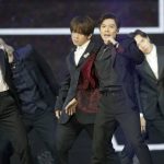 
              Members of Cantopop boyband "Mirror" perform at the Hong Kong Film Awards, Sunday, July 17, 2022. (AP Photo/Kin Cheung)
            